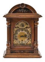 A German walnut clock, with brass and silvered dial, early 20th c, pendulum, 46cm h; 32 x 21cm Minor