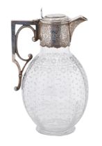 A Victorian silver mounted glass claret jug, the ovoid body engraved with flowers and stars, 23cm h,