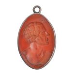 A carnelian intaglio gem, 19th c, engraved with a head and shoulders length profile of a classical