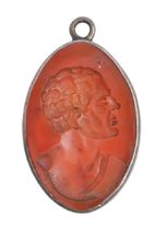 A carnelian intaglio gem, 19th c, engraved with a head and shoulders length profile of a classical