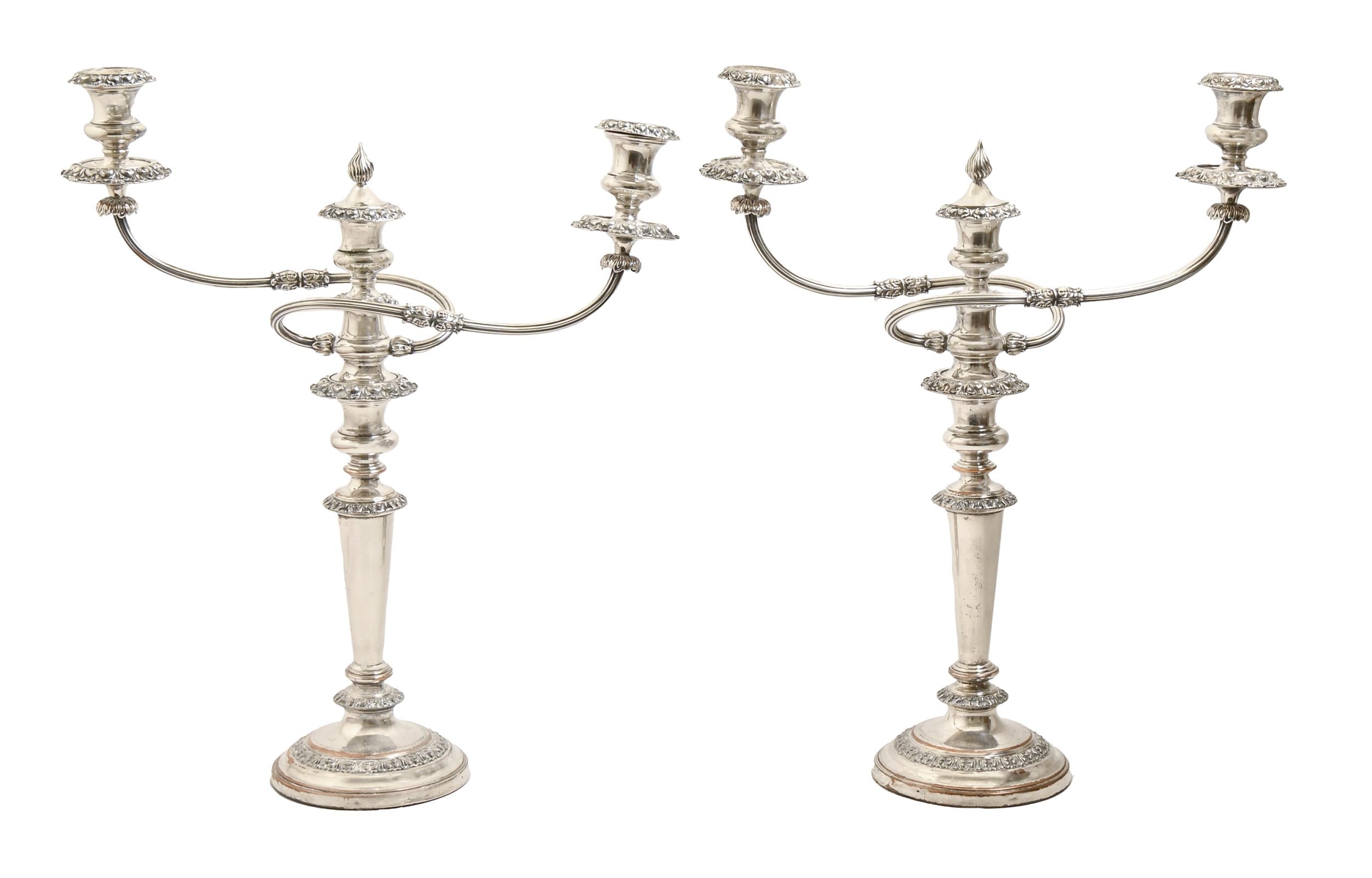A pair of EPNS candelabra, early 20th c, of three lights, flambeau finial, 48.5cm h Localised wear