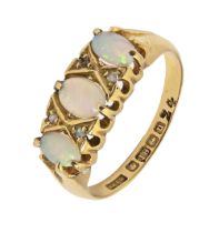 An opal ring with diamond accents, in 18ct gold, Birmingham 1919, 2.8g, size M Opals scratched and