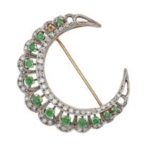 An emerald and diamond crescent brooch, mounted in two colour gold and millegrain set, 40mm, 10.5g