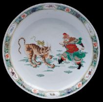 A Chinese famille verte dish, 19th c, enamelled with a ferocious tiger and equally ferocious man,