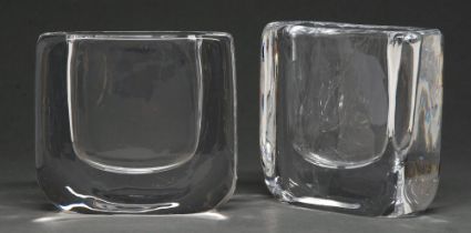 Nils Landberg for Orrefors. A pair of modernist glass vases, the clear almost square block with U-