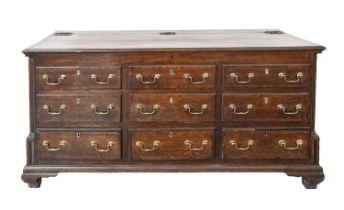 A George III oak 'Lancashire' mule chest, with iron serpent hinges, the sides panelled, 89cm h;