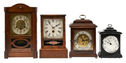 A 1930s stained wood mantel clock, the brass dial with silvered chapter ring, pendulum and key, 38cm