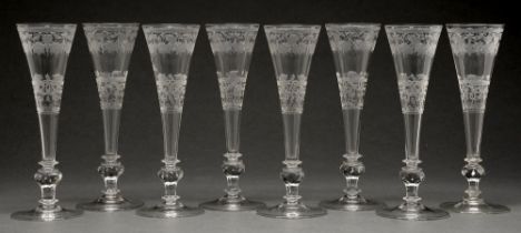 A set of eight Bohemian glass flutes, 20th c, finely engraved with festoon border above a band of