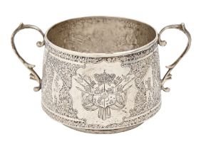 A South East Asian silver sugar bowl, c1900, engraved with armorials and to the reverse the figure