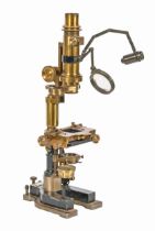 A Victorian brass and black painted cast iron microscope, Tisley & Spiller 172 Brompton Road London,