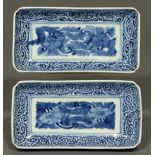 A pair of Japanese blue and white rectangular dishes, 19th c, painted with flowers in karakusa