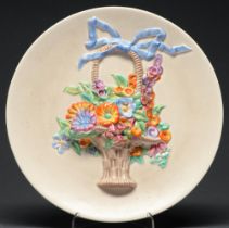 Clarice Cliff. A My Garden pattern basket of flowers moulded plaque, 1930s, 33.5cm diam, printed