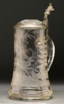 An etched pewter mounted glass stein, c1900, with applied handle, cut glass lid, etched with hunting