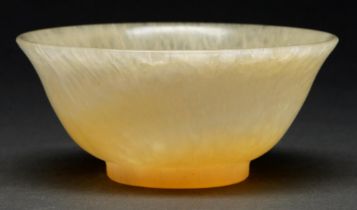 A Chinese semi-translucent mottled stone bowl, gently curved sides, slightly everted rim, 12cm