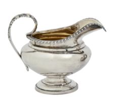 A William IV silver cream jug, with gadrooned rim, 10cm h, by Charles Fox, London 1835, 4ozs 6dwts