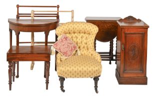 A Victorian nursing chair, on ebonised legs with castors, a Victorian mahogany towel rail and