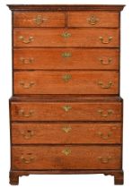 A George III oak chest on chest, with deal or pine lined drawers, 167cm h; 51 x 105cm Small chip
