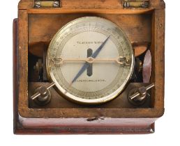 A brass galvanometer, the dial inscribed Telegraph Works Silvertown London, in fitted stained wood