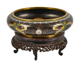 A Chinese cloisonne enamel bowl, 20th c, with ferocious dragons on a black ground, 20cm diam, four