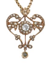 An aquamarine and split pearl openwork brooch-pendant, early 20th c, in gold, 38mm h, marked 9ct and