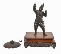 A Japanese bronze statuette of a samurai, early 20th c, 30.5cm h including carved wood base Upraised