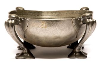 Liberty & Co. A pewter four footed flower bowl designed by Oliver Baker, early 20th c, 26cm diam,