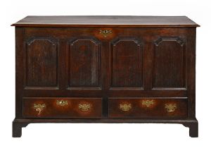 A George III oak mule chest, with four ogee raised-and-fielded panels to the sides, also panelled,