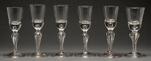 Six Bohemian wine glasses, the rounded funnel bowl with solid base with tier, on moulded pedestal