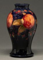 A Moorcroft Pomegranate vase, c1920, 21cm h, impressed marks, green painted signature Professional