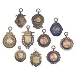 Ten silver cricket and other sporting watch fob shields, 1930's / 40's, several enamelled, 89g As