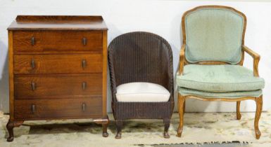 A French walnut elbow chair, oak chest of drawers, 88cm h x 73cm w and Lloyd Loom style nursing