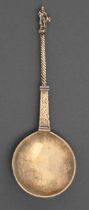 A Dutch silver gilt apostle spoon, the round bowl on engraved pillar shaped and spiral stem