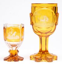 Two Bohemian amber flashed glass goblets, c1870, the larger wheel engraved with horses, the