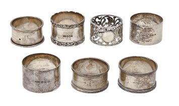 Seven Edward VII and George VI silver napkin rings, including an Art Nouveau pierced example,