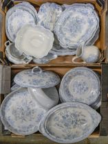 An extensive earthenware blue and white printed dinner service, late 19th c, including tureens and