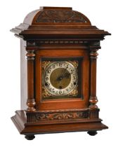 A German walnut basket-top mantel clock, c1900, the movement chiming on rod gongs, brass and