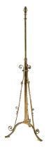 An Edwardian brass telescopic oil lamp, on tripod, adapted for electricity, 149cm h Complete