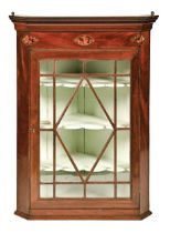 A Victorian mahogany hanging corner cabinet, with three shell paterae, 100cm h; 42 x 75cm Cornice