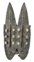 Tribal art. Western African - a carved wood mask, possibly Grebo, Ivory Coast, mid 20th c, 55cm x