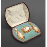 A fine shell cameo demi-parure, c1870, the cameos to the earrings emblematic of night and day,