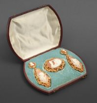 A fine shell cameo demi-parure, c1870, the cameos to the earrings emblematic of night and day,