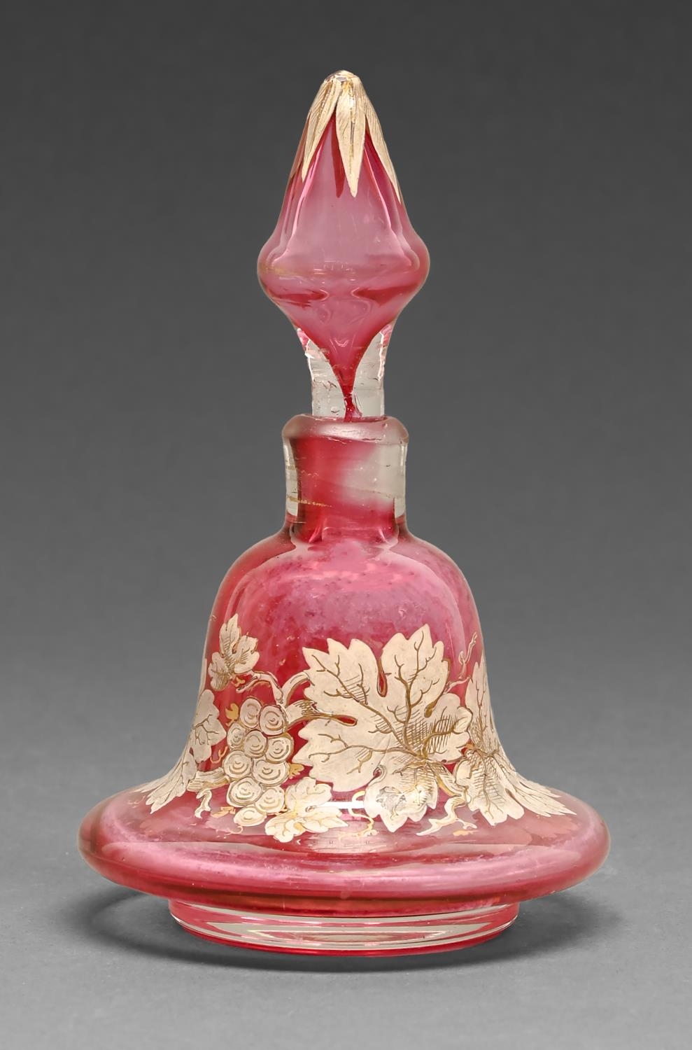 A Victorian bell shaped cranberry glass enamelled and gilt scent bottle and stopper, 14cm h