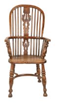 A Victorian ash Windsor chair, Nottinghamshire or South Yorkshire, with elm seat, 106cm h Complete