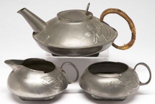Liberty & Co. A Tudric pewter sugar bowl and milk jug and a teapot with wicker wrapped handle en