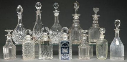 Ten and a pair of cut, faceted or engraved glass decanters and stoppers, mostly British, early