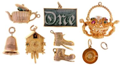 Eight various 9ct gold bracelet charms, including cuckoo clock, teapot and basket of flowers,