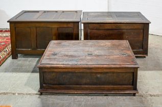 A panelled oak blanket box, early 20th c, 53cm h; 87 x 47cm and two other similar chests