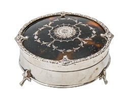 A George V round silver inlaid tortoiseshell inset trinket box, 95mm diam, by Adie Brothers Ltd,
