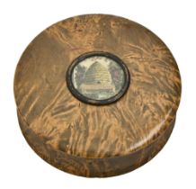 A turned and stained 'mulberry' (field maple) snuff box, early 19th c, the cover inset with a hand