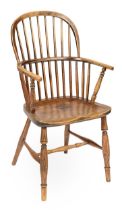 A Lincolnshire low stick back Windsor armchair, John Amos, Grantham, c1814-1842, of ash with elm